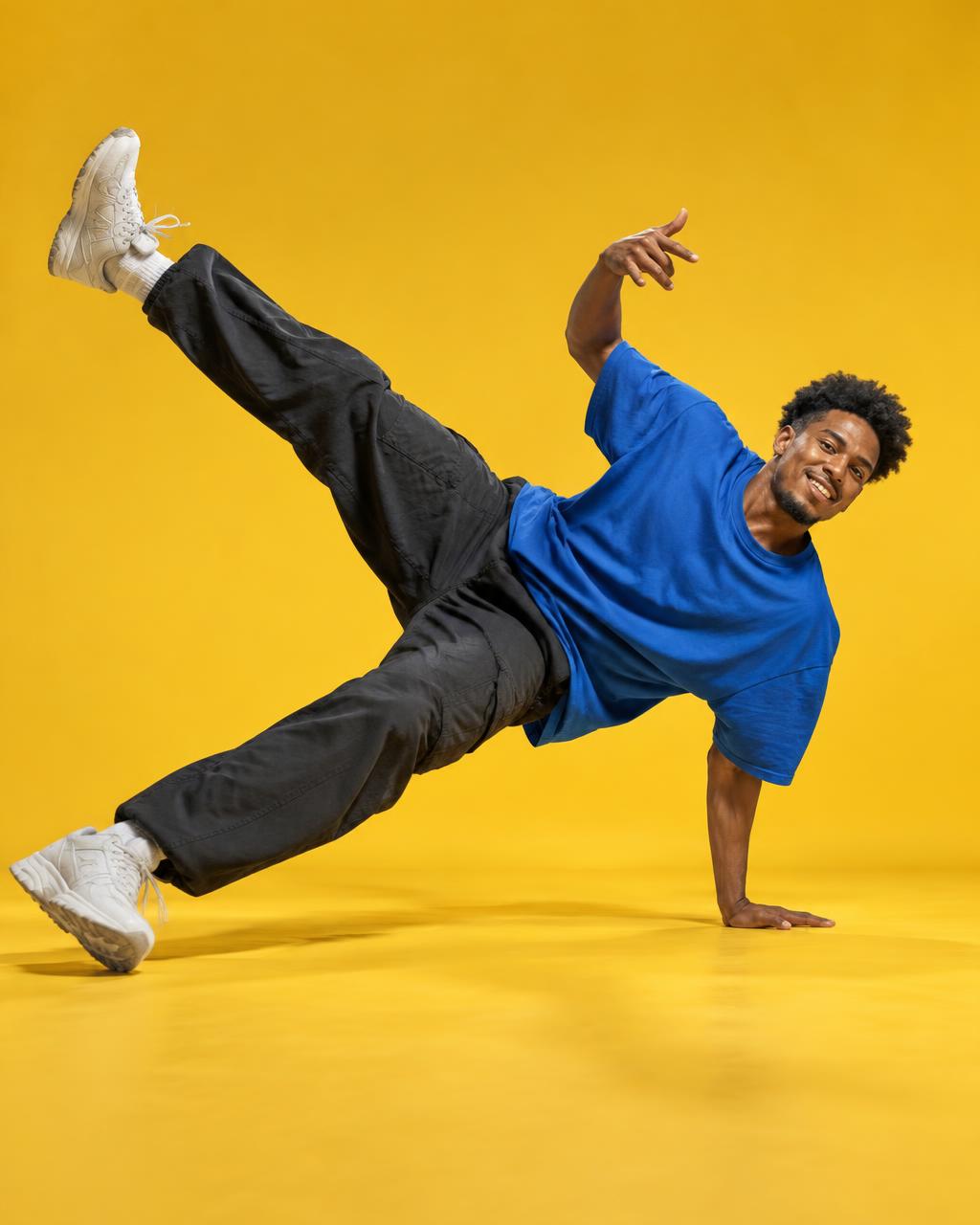 Illustrative breaker holding a dynamic side freeze in a blue shirt against a golden-yellow background
